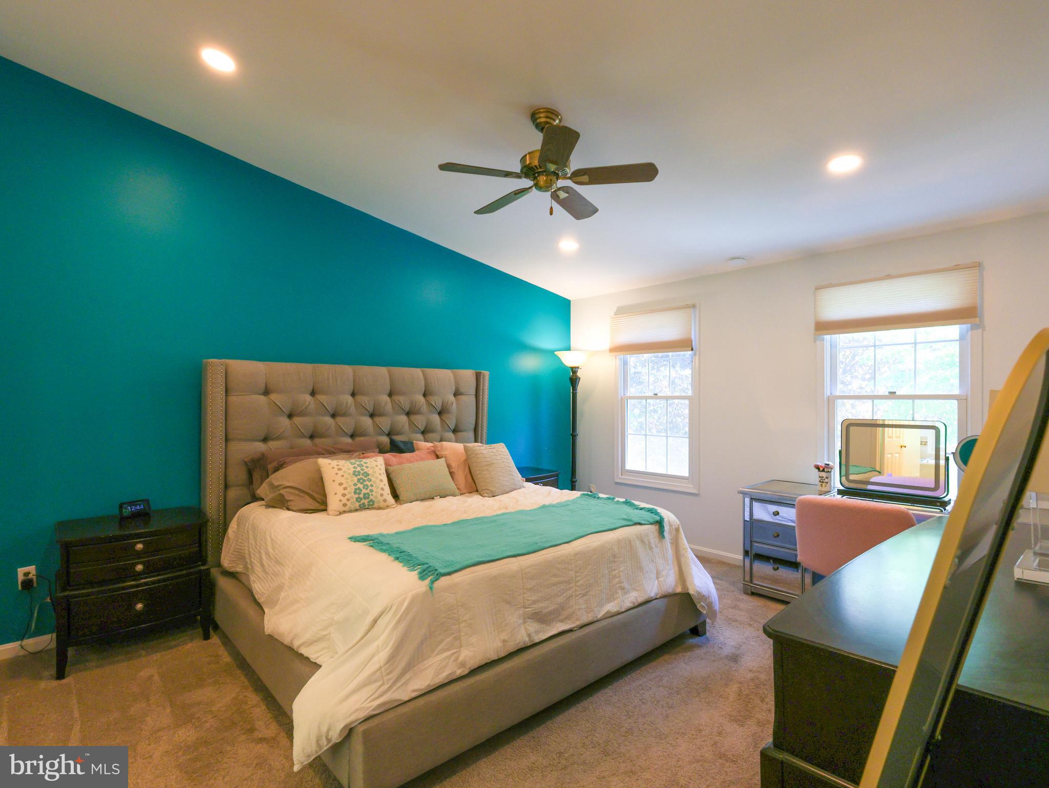 18500 Gingerbread Lane Gaithersburg, MD 20877 - Photo 25 of 56 a bedroom with a bed window and a table