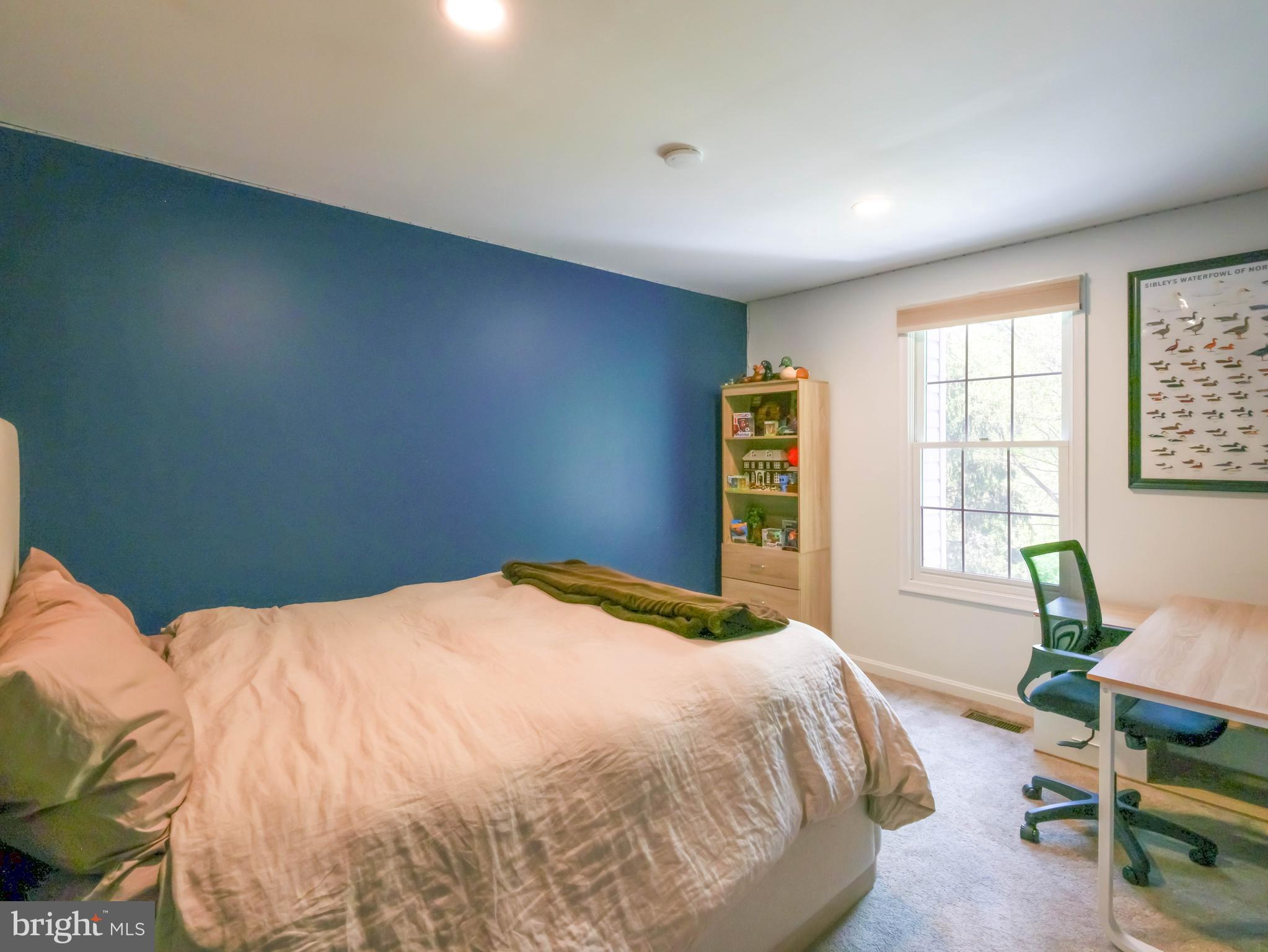 18500 Gingerbread Lane Gaithersburg, MD 20877 - Photo 33 of 56 a bedroom with a bed and wooden floor