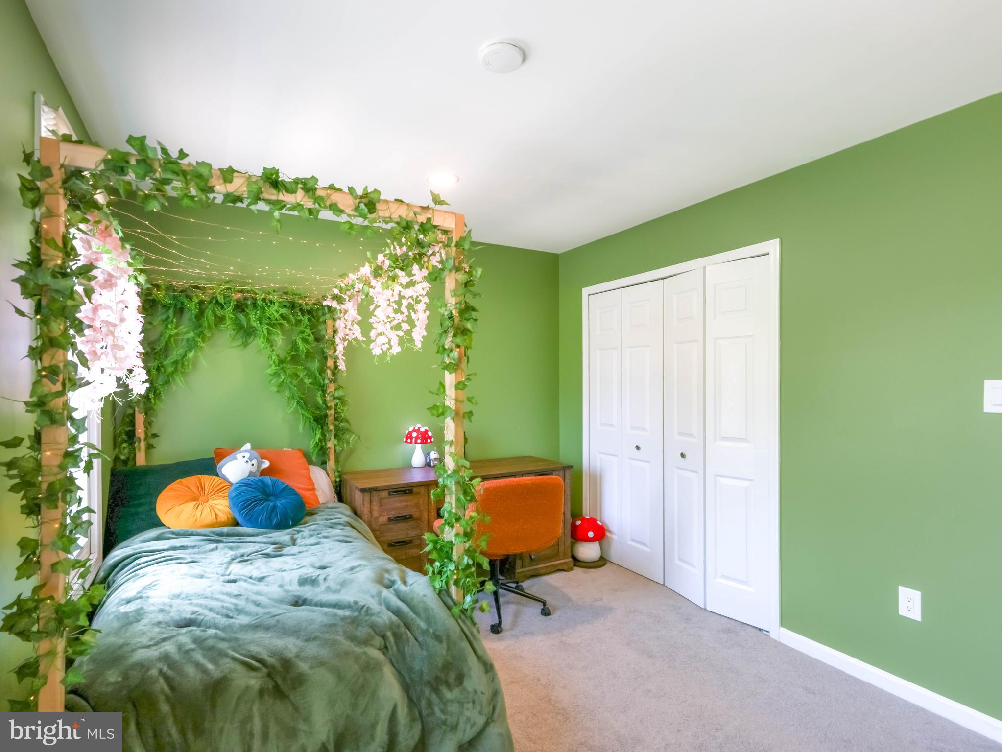 18500 Gingerbread Lane Gaithersburg, MD 20877 - Photo 36 of 56 a bedroom with a bed table and a chair