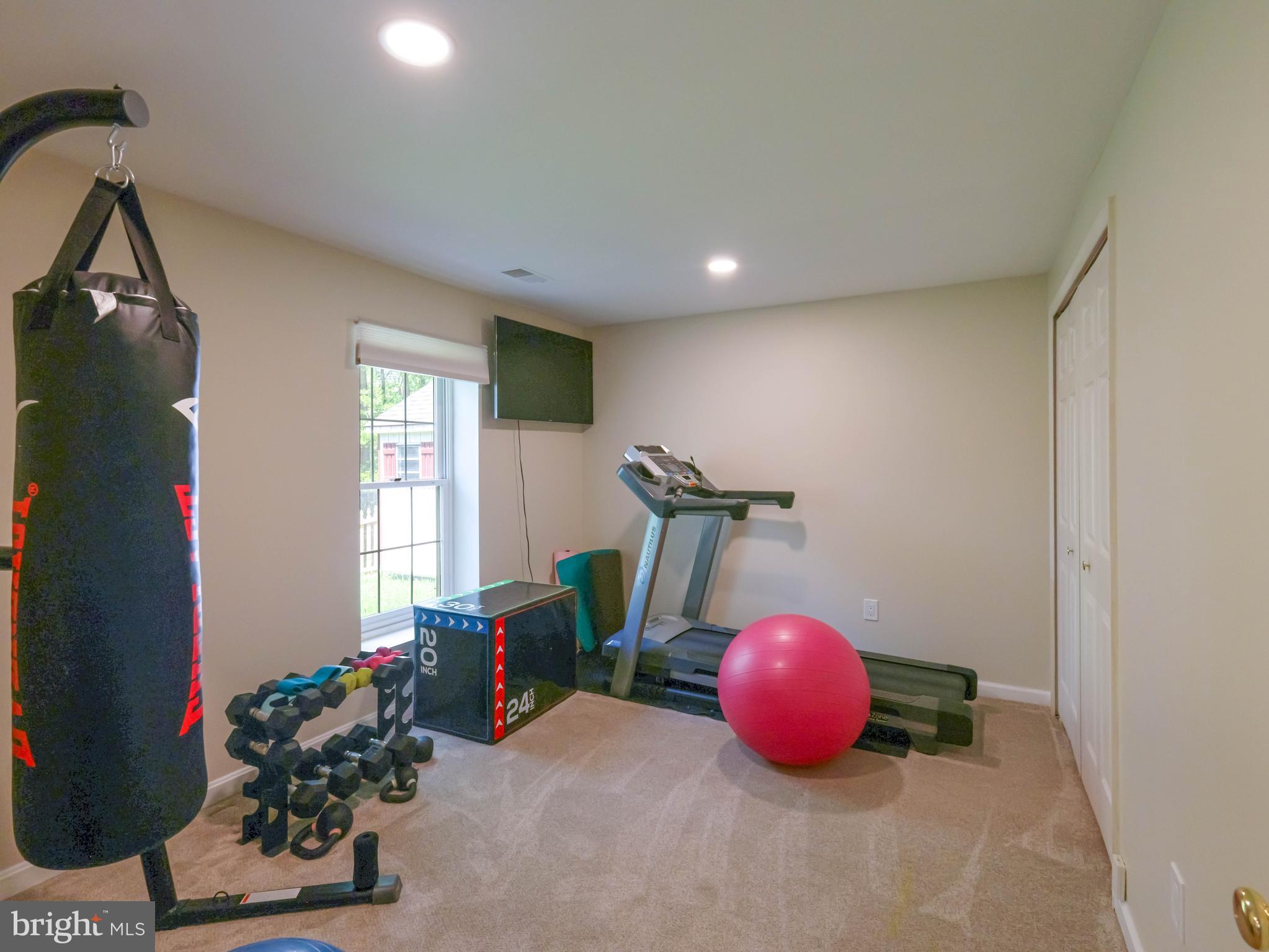 18500 Gingerbread Lane Gaithersburg, MD 20877 - Photo 46 of 56 a room with a table and gym equipment