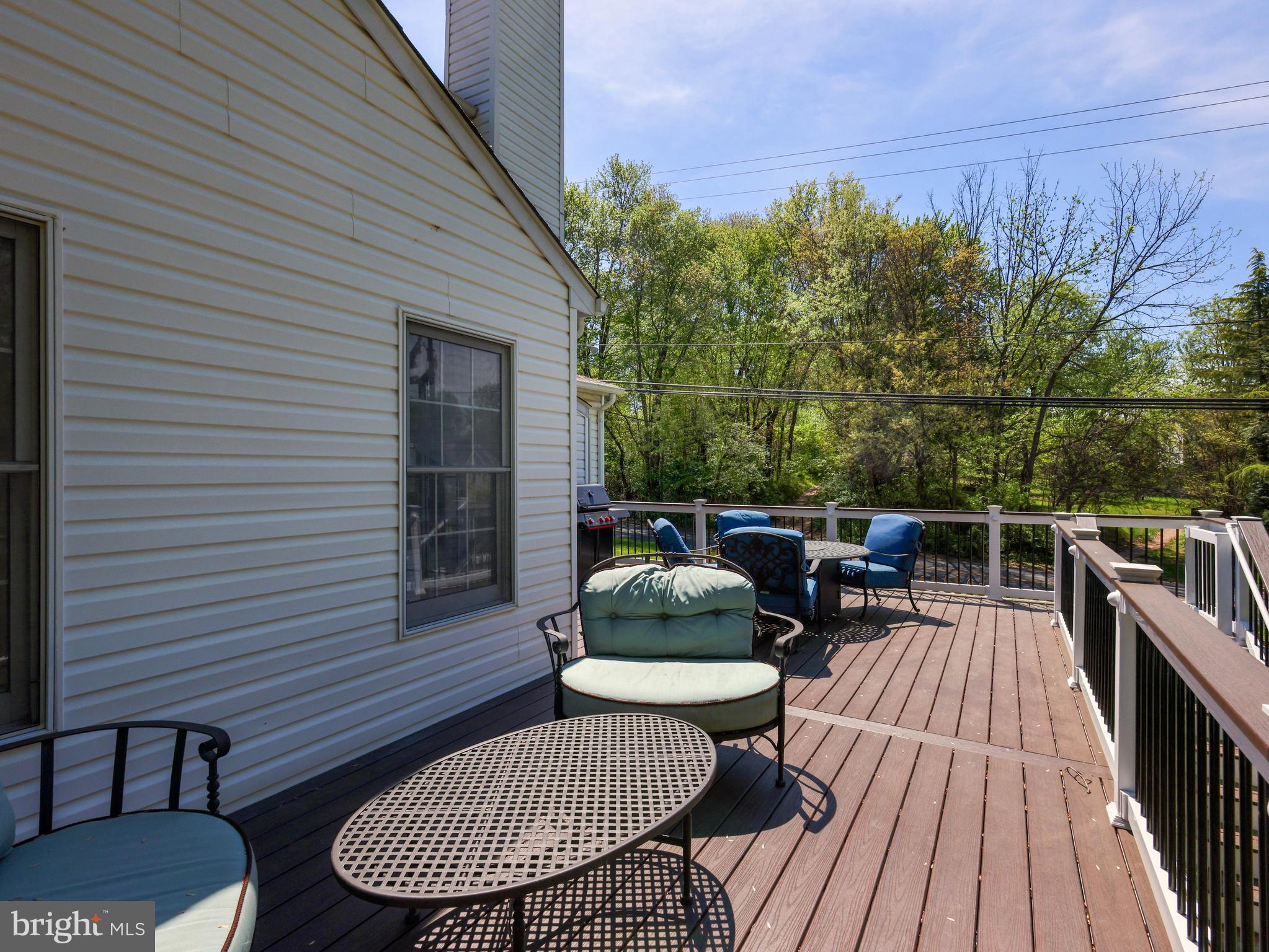 18500 Gingerbread Lane Gaithersburg, MD 20877 - Photo 53 of 56 a balcony with wooden floor table and chairs