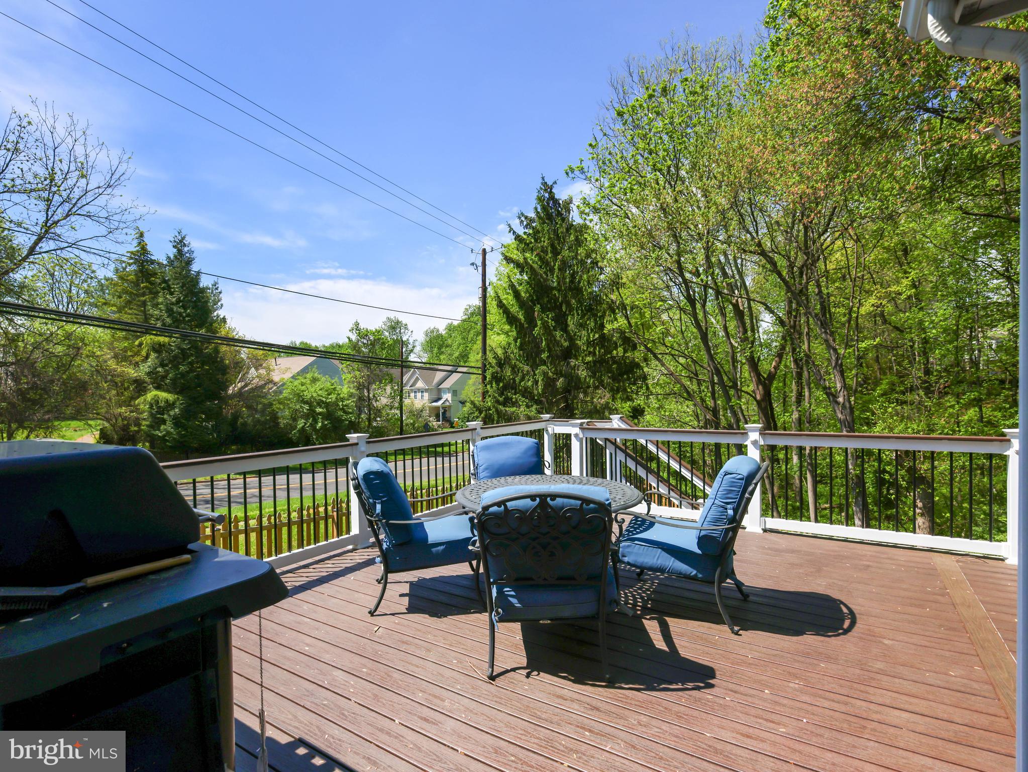 18500 Gingerbread Lane Gaithersburg, MD 20877 - Photo 55 of 56 a roof deck with table and chairs and wooden floor