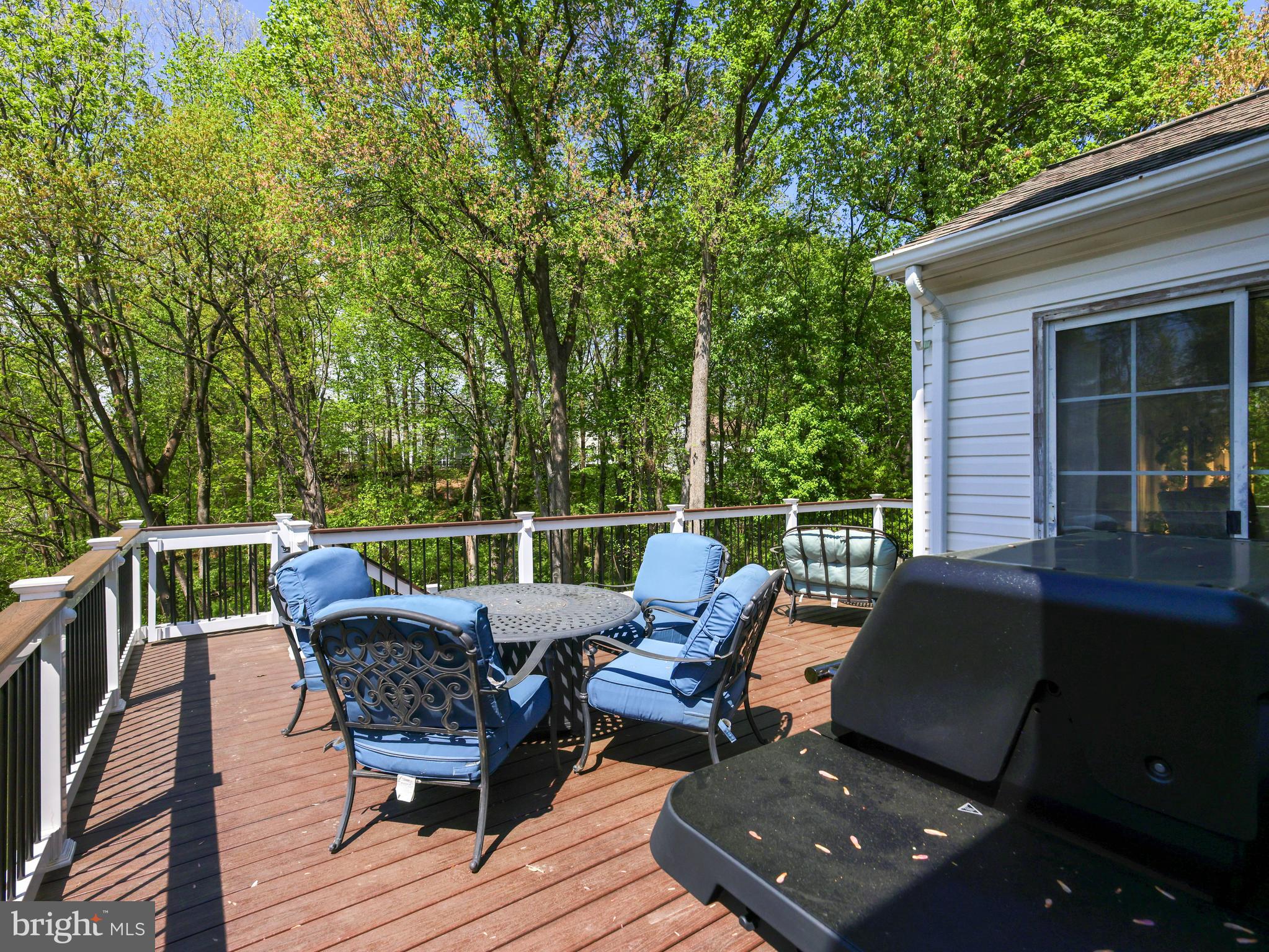 18500 Gingerbread Lane Gaithersburg, MD 20877 - Photo 56 of 56 a view of a roof deck with table and chairs and wooden floor