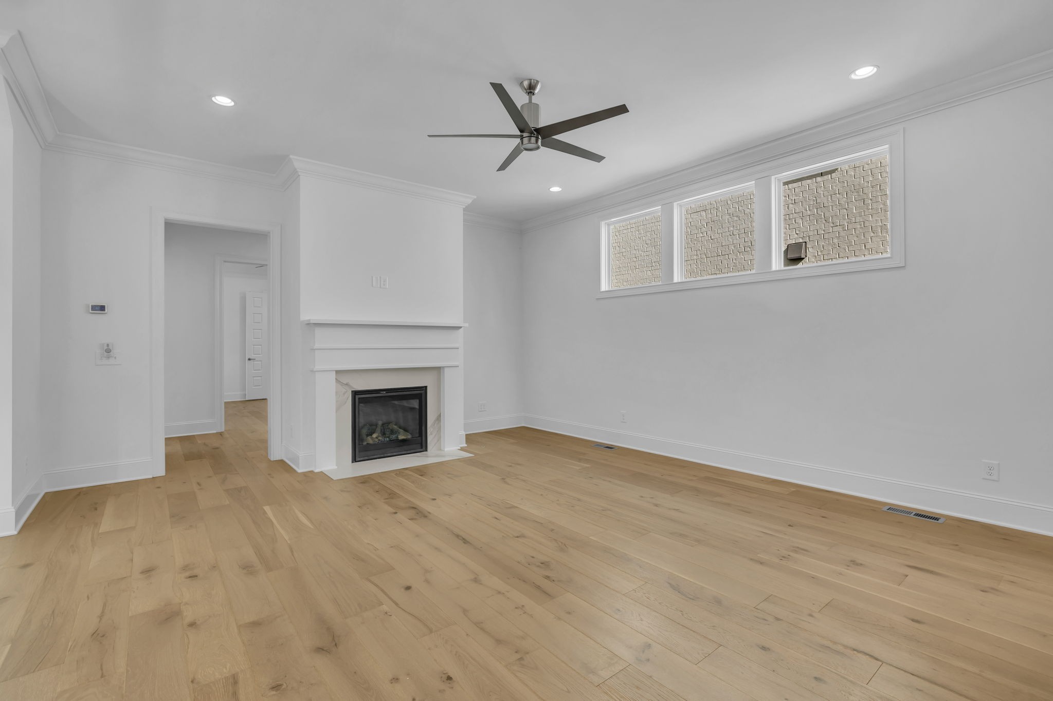 2018 Nathaniel Road Franklin, TN 37064 - Photo 13 of 52 a view of a livingroom with a fireplace and a ceiling fan