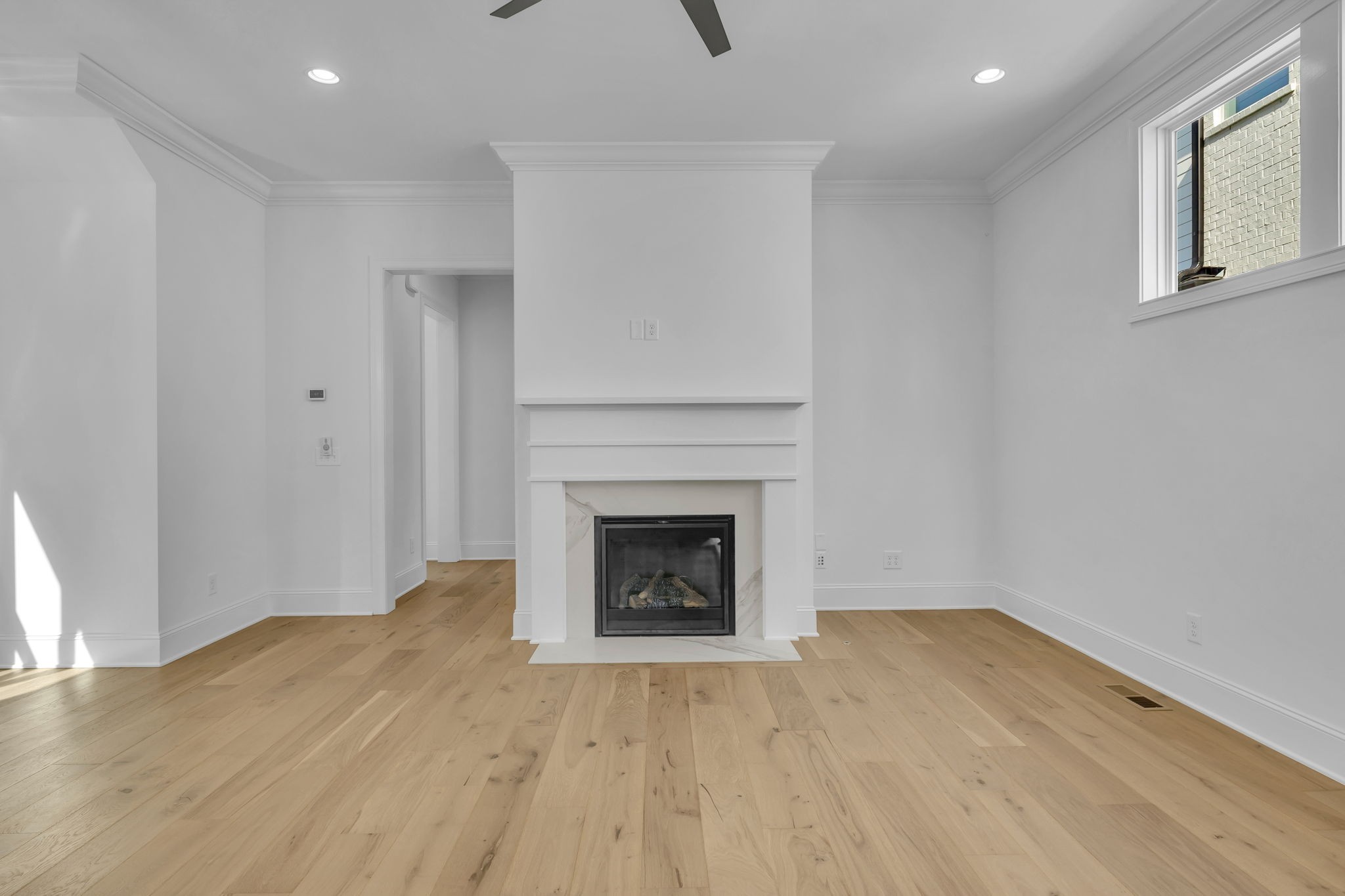 2018 Nathaniel Road Franklin, TN 37064 - Photo 14 of 52 a view of an empty room with wooden floor and a fireplace