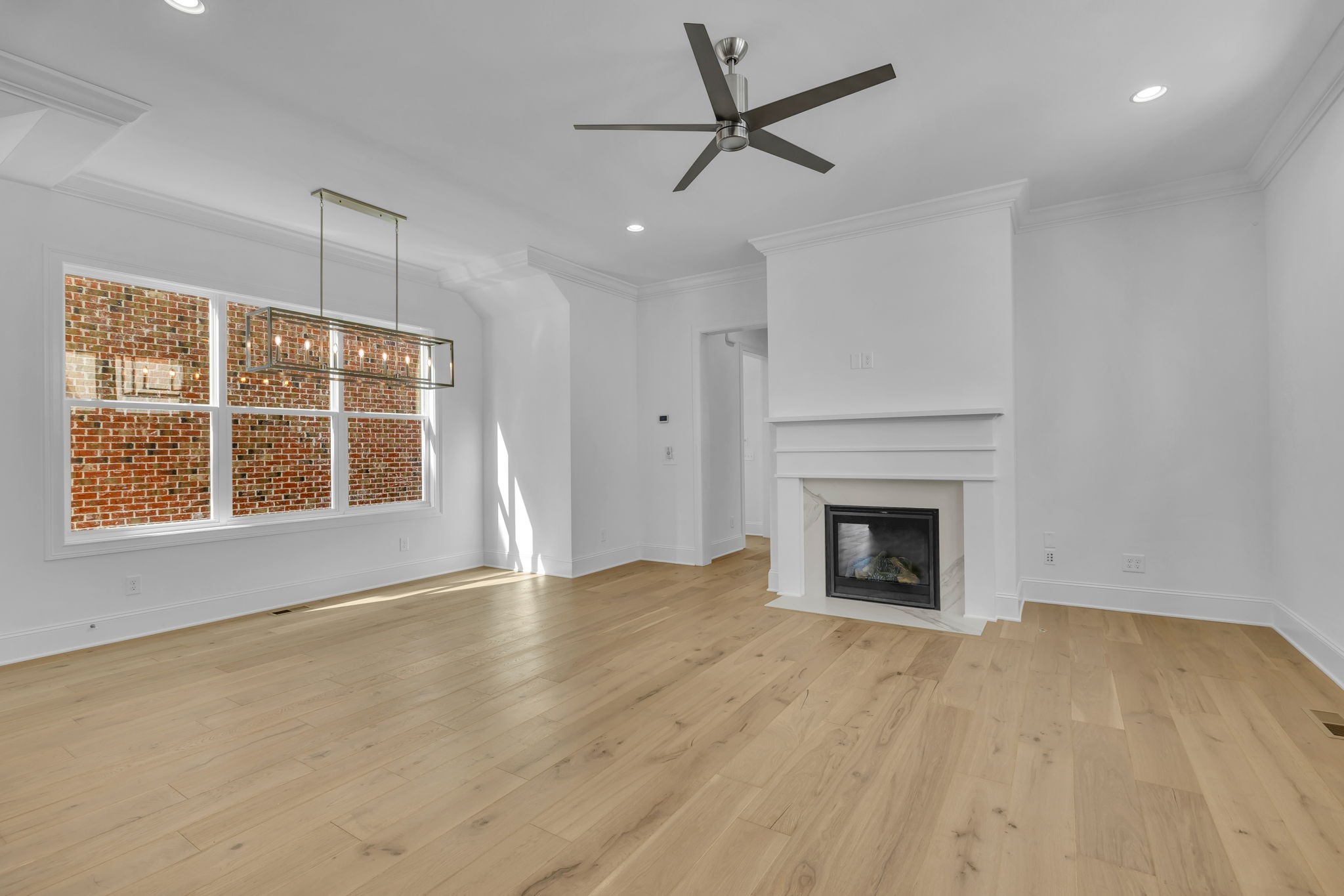 2018 Nathaniel Road Franklin, TN 37064 - Photo 15 of 52 an empty room with windows and fireplace