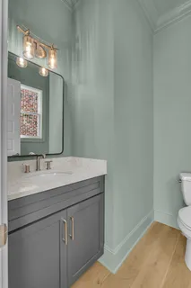 a bathroom with a sink vanity and a mirror