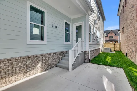 a side view of a house with a yard