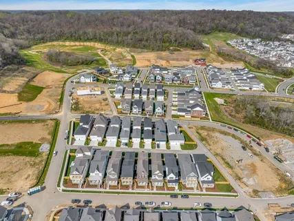an aerial view of residential building with parking space