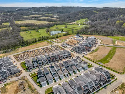 an aerial view of residential building with lake view