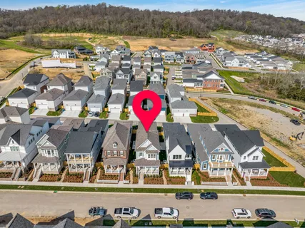 an aerial view of a house with a garden