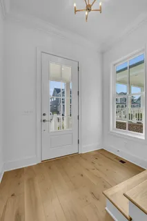 a view of a room with a window and cabinet area