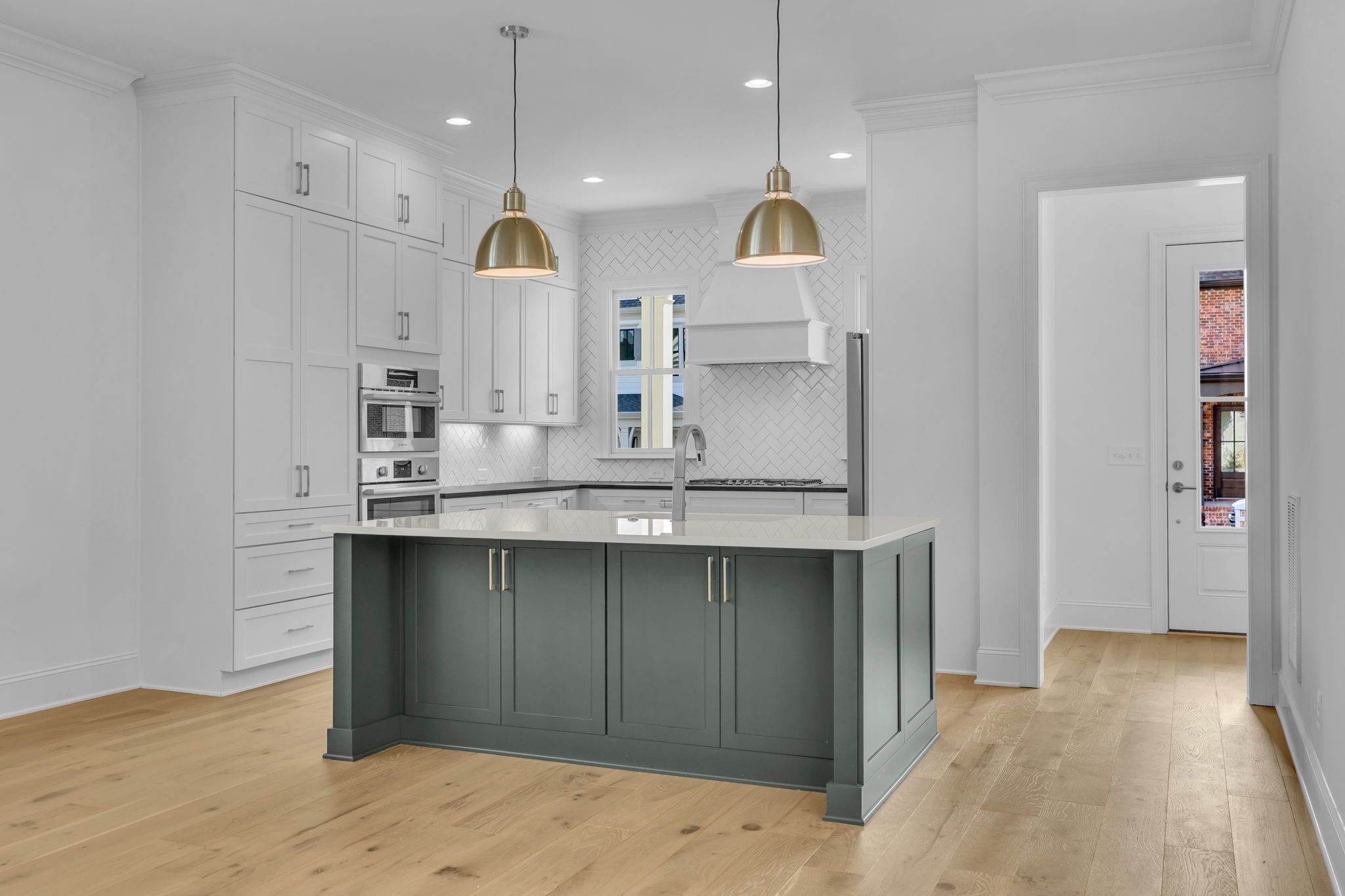 2018 Nathaniel Road Franklin, TN 37064 - Photo 6 of 52 a view of a kitchen with kitchen island a sink stainless steel appliances and cabinets