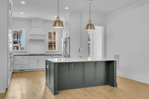 a kitchen with cabinets and window