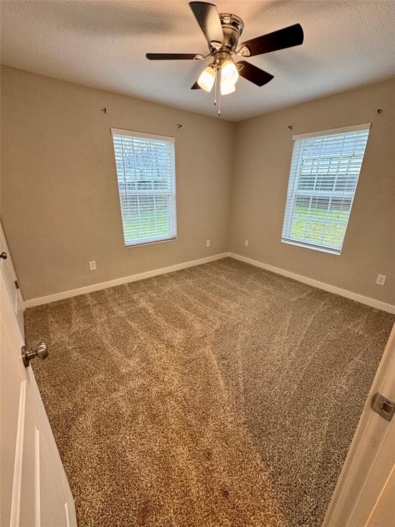 508 Sherry Street Quinlan, TX 75474 - Photo 11 of 20 a view of an empty room with a window