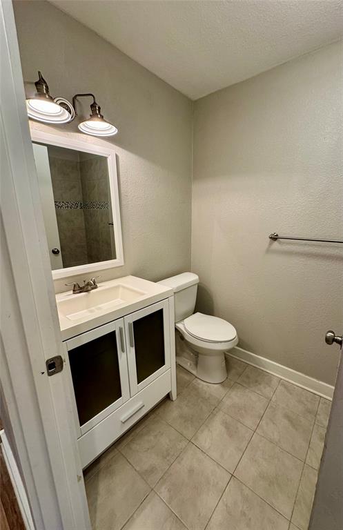 508 Sherry Street Quinlan, TX 75474 - Photo 12 of 20 a utility room with a stove a washer and dryer