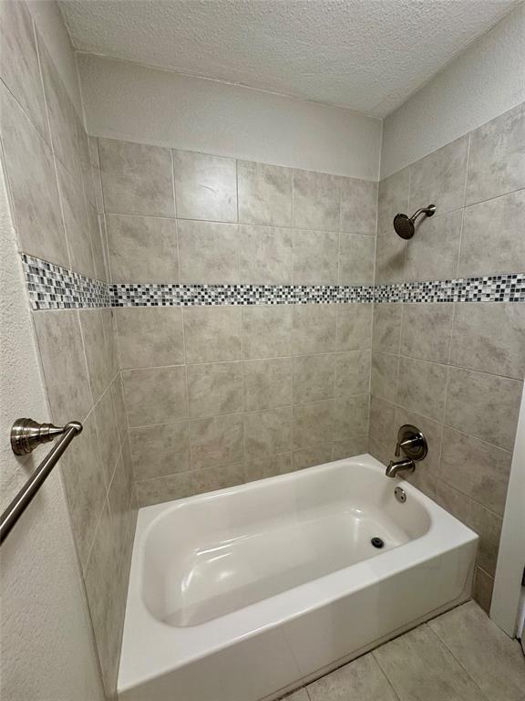 508 Sherry Street Quinlan, TX 75474 - Photo 13 of 20 a bathroom with a tub and a shower
