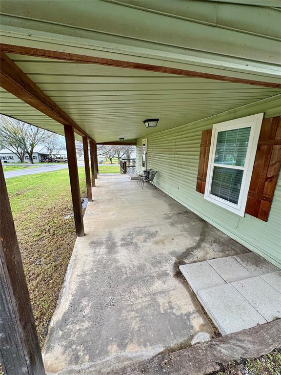 508 Sherry Street Quinlan, TX 75474 - Photo 16 of 20 a view of a porch door