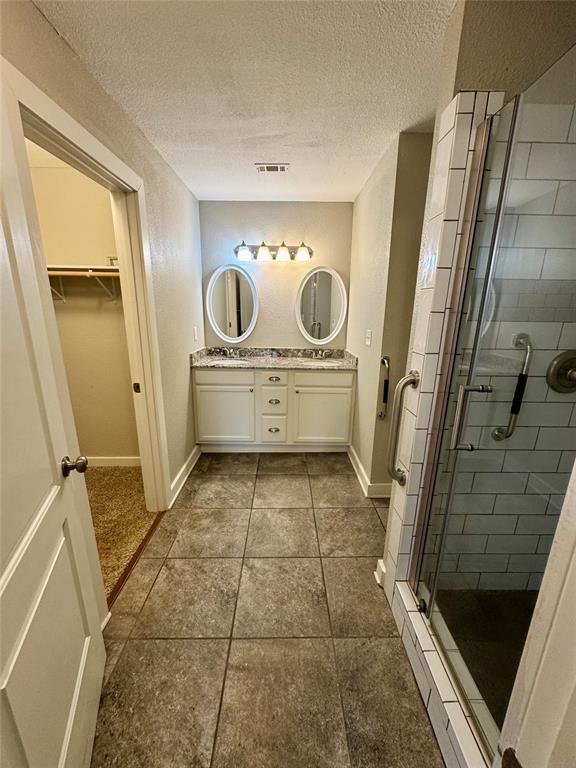 508 Sherry Street Quinlan, TX 75474 - Photo 7 of 20 a bathroom with a sink a toilet a mirror and shower