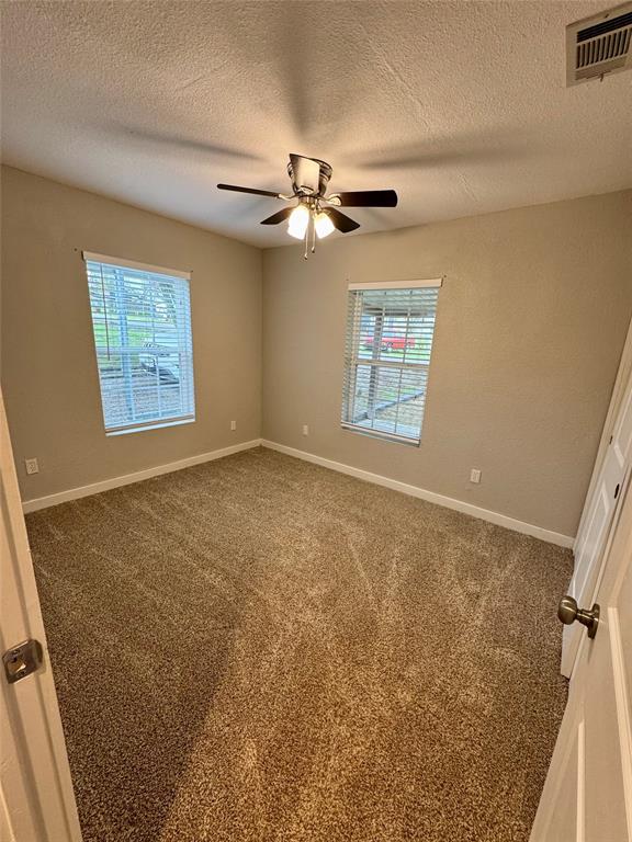 508 Sherry Street Quinlan, TX 75474 - Photo 10 of 20 a view of an empty room with a window