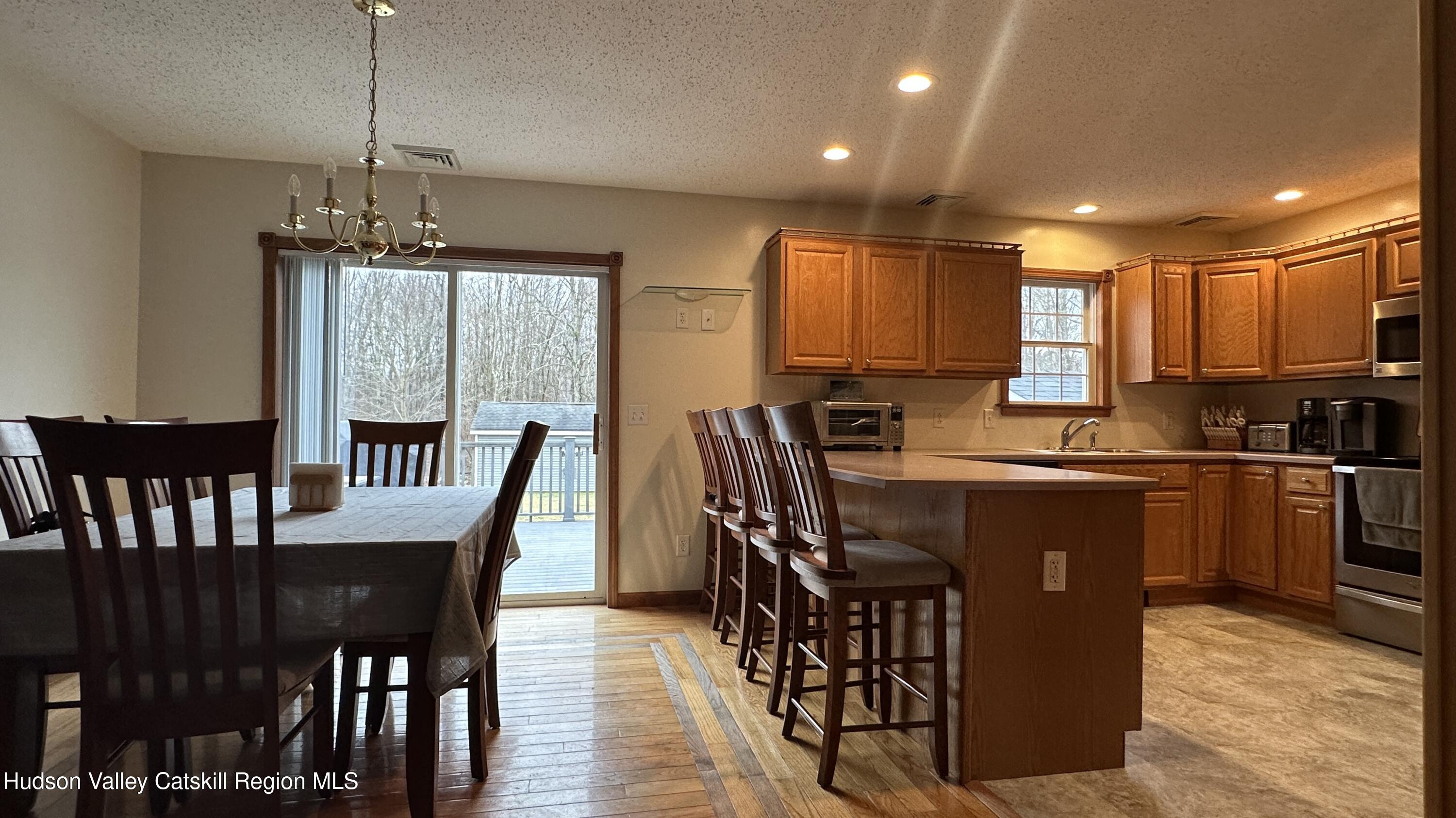 473 North Riverside Road Highland, NY 12528 - Photo 6 of 22 a view of a dining room with furniture window and wooden floor