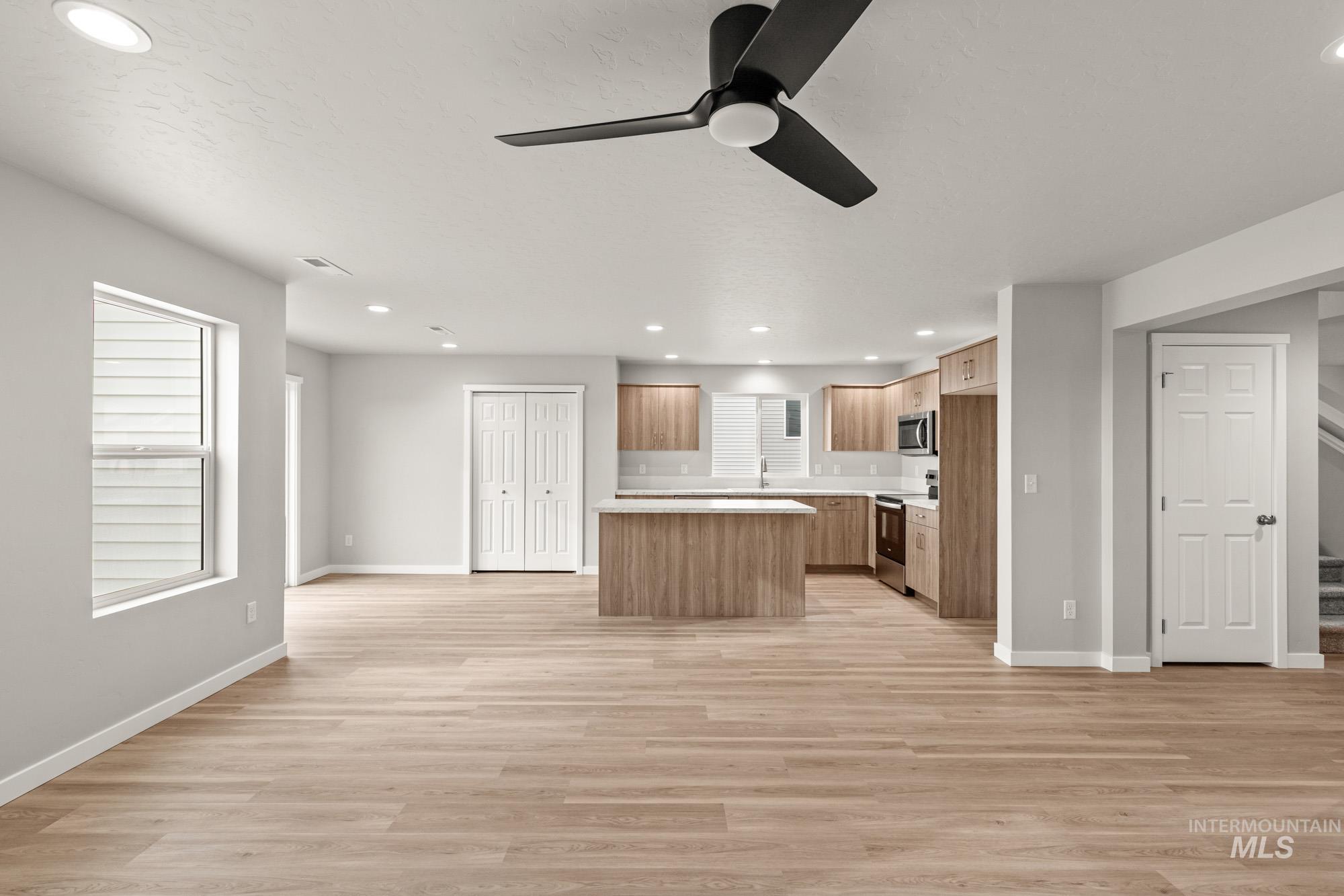 1515 Long Pond Street Middleton, ID 83644 - Photo 24 of 25 Kitchen with open floor plan, recessed lighting, light countertops, ceiling fan, and a center island