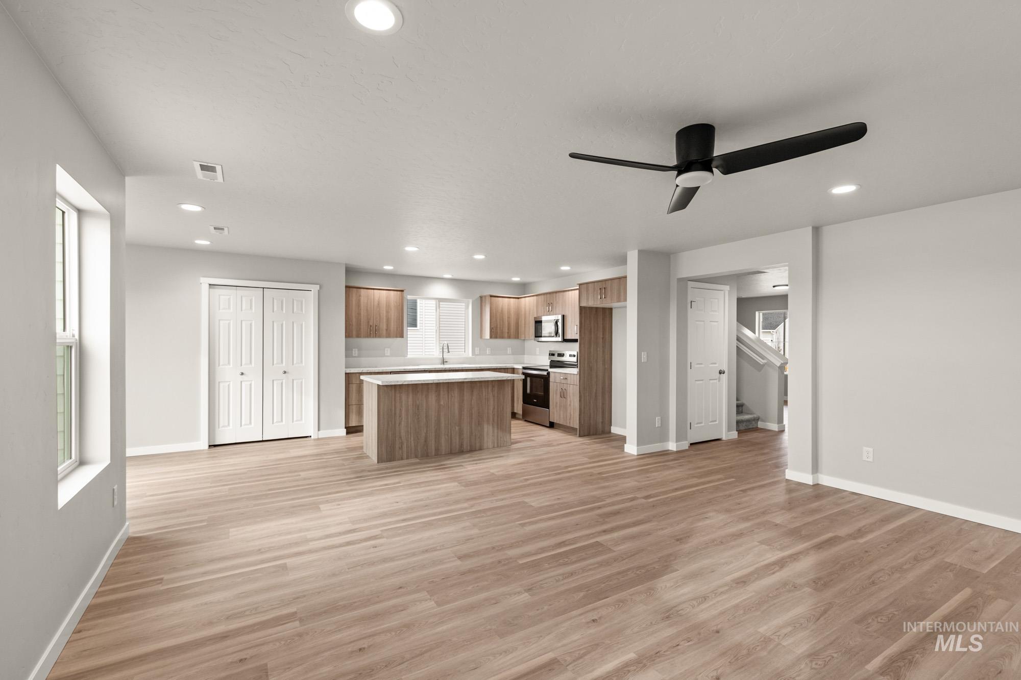 1515 Long Pond Street Middleton, ID 83644 - Photo 25 of 25 Kitchen with open floor plan, a kitchen island, stainless steel appliances, a ceiling fan, and recessed lighting