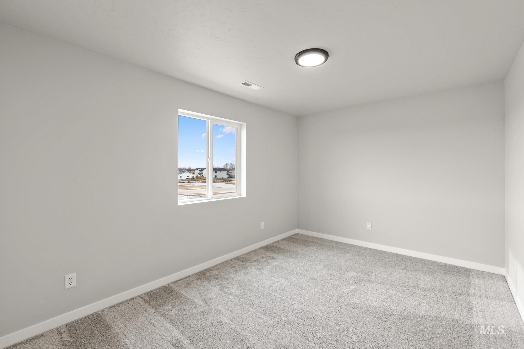 1515 Long Pond Street Middleton, ID 83644 - Photo 13 of 25 Spare room with carpet flooring and baseboards
