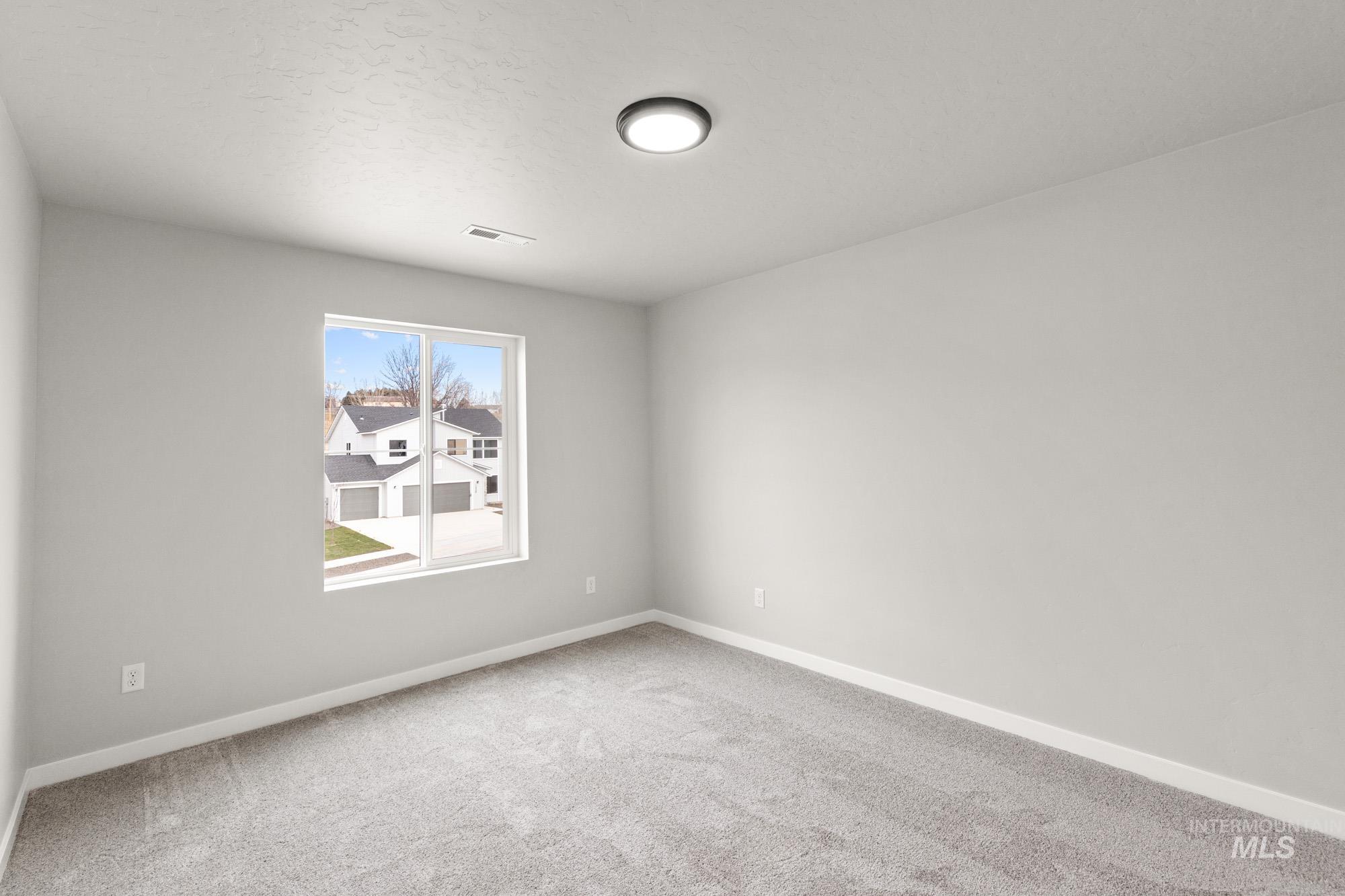 1515 Long Pond Street Middleton, ID 83644 - Photo 20 of 25 Empty room with baseboards and carpet floors