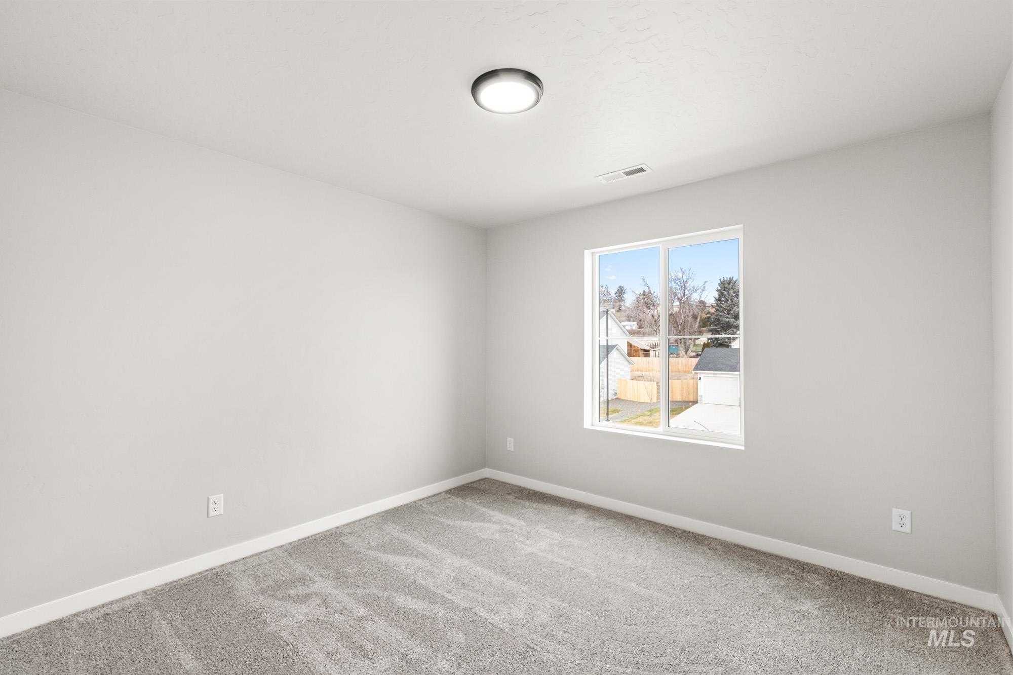 1515 Long Pond Street Middleton, ID 83644 - Photo 22 of 25 Unfurnished room featuring carpet flooring and baseboards