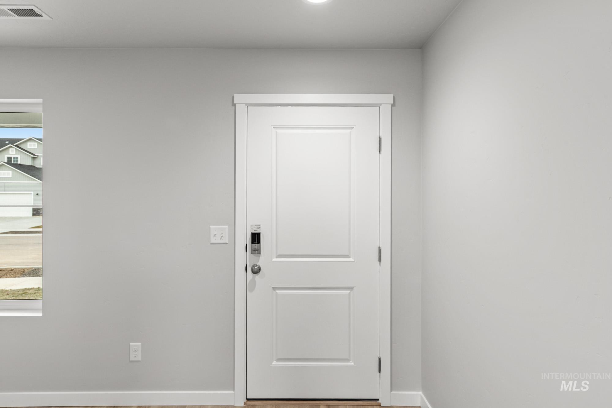 1515 Long Pond Street Middleton, ID 83644 - Photo 3 of 25 Doorway to outside featuring baseboards