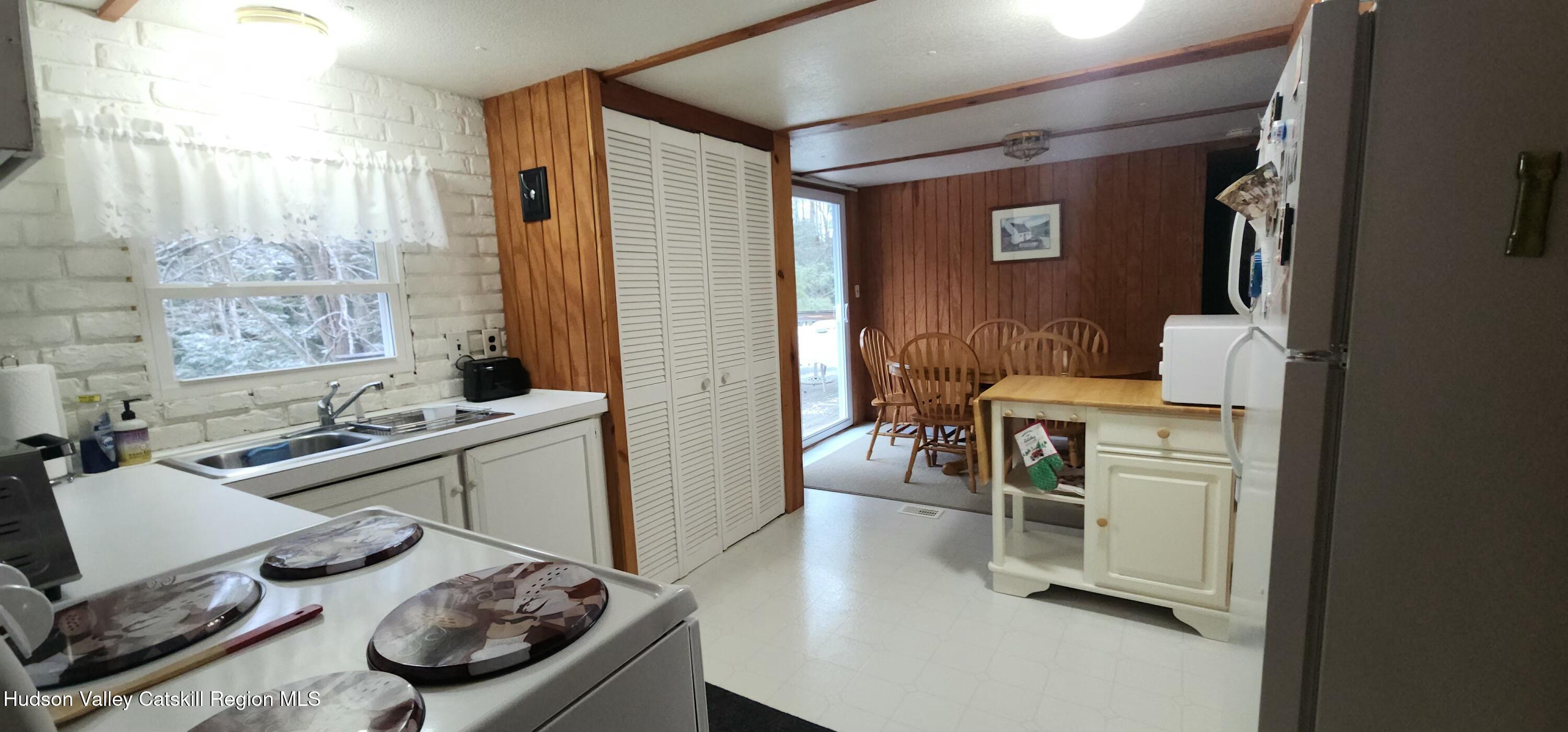315 Begley Road Windham, NY 12496 - Photo 6 of 22 a room with furniture and a gate