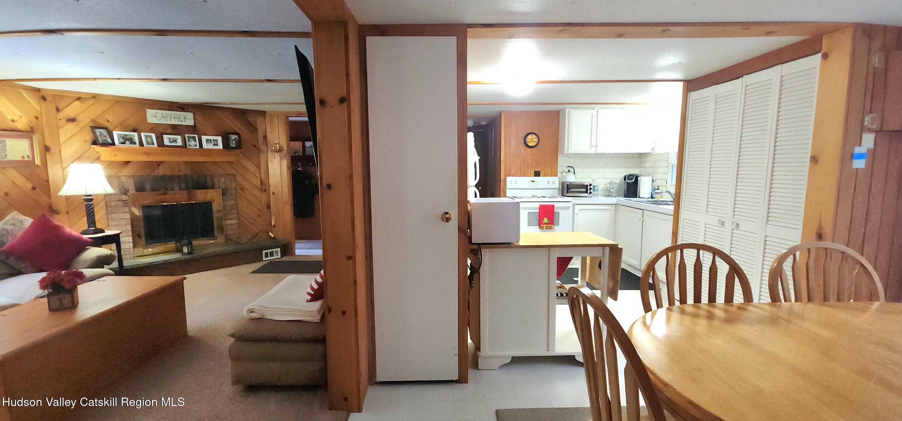 315 Begley Road Windham, NY 12496 - Photo 8 of 22 a workspace with furniture fire place and a fireplace