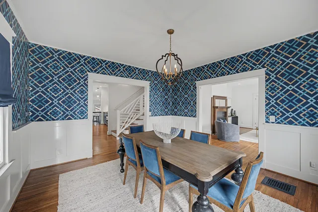 a view of entryway with dining room and wooden floor