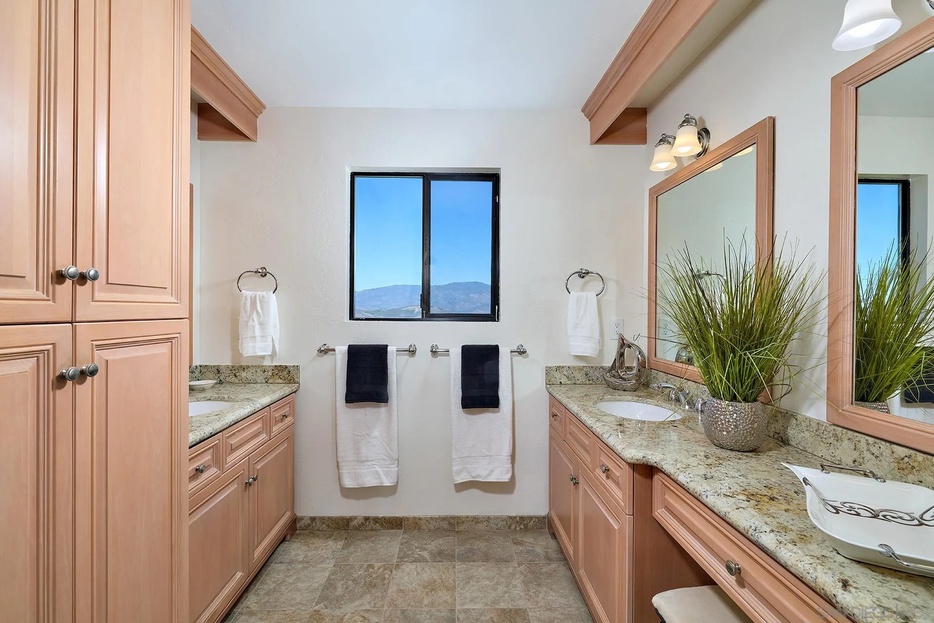 13588 McNally Road Valley Center, CA 92082 - Photo 26 of 43 a large kitchen with granite countertop a sink and dishwasher a stove with wooden floor