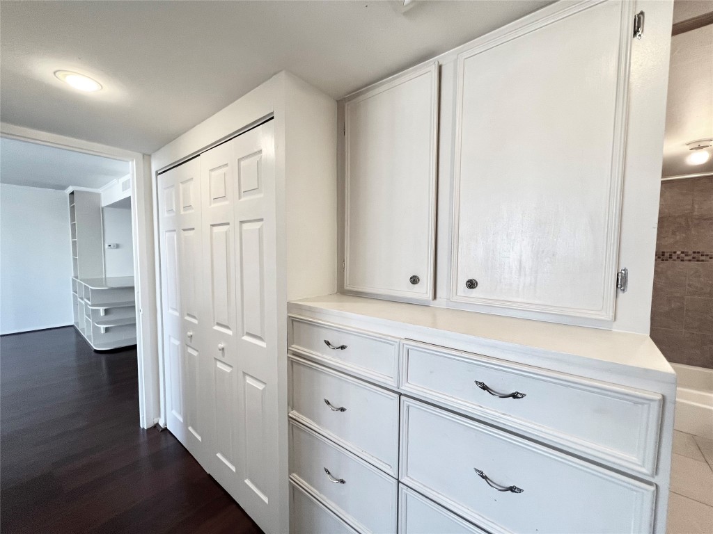 2016 Main Street, Unit 2405 Houston, TX 77002 - Photo 12 of 40 a view of cabinets and wooden floor