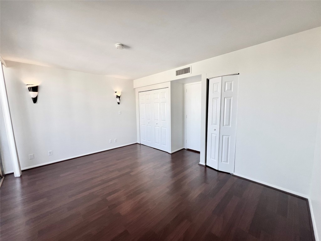 2016 Main Street, Unit 2405 Houston, TX 77002 - Photo 17 of 40 a view of an empty room with wooden floor
