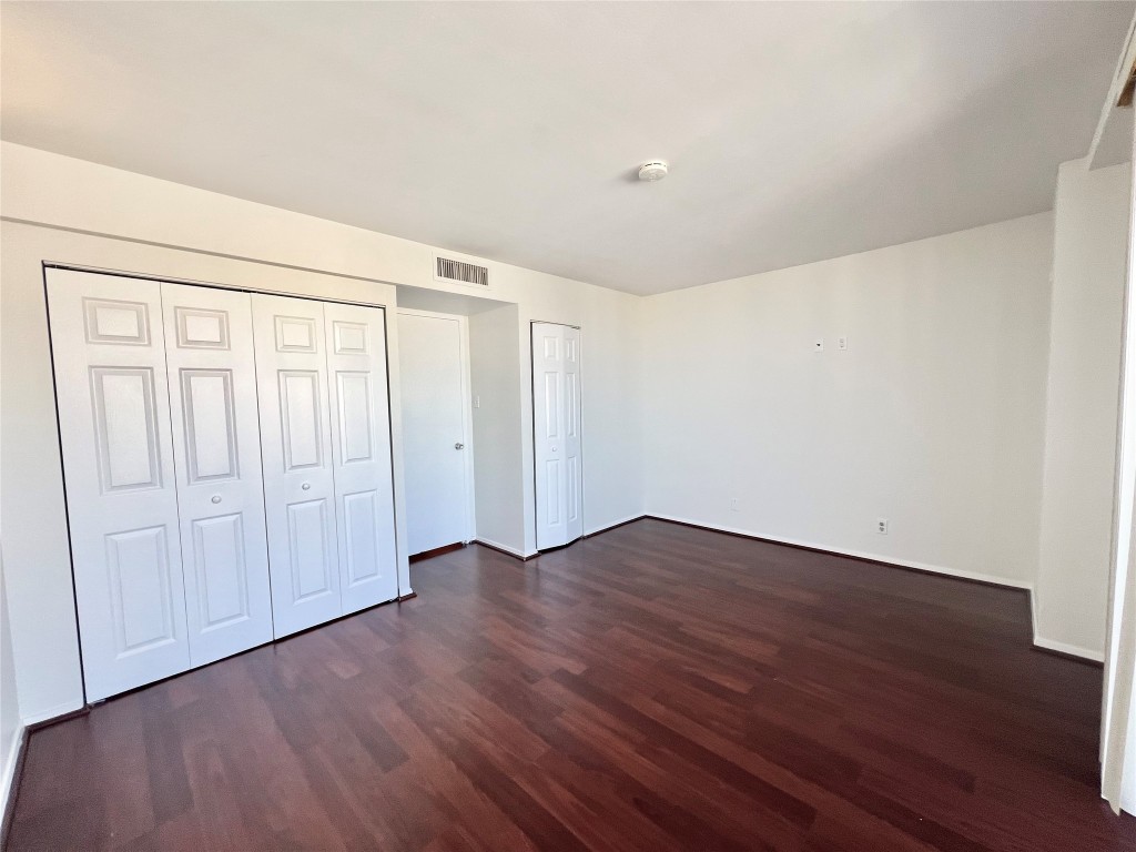 2016 Main Street, Unit 2405 Houston, TX 77002 - Photo 18 of 40 a view of an empty room with wooden floor