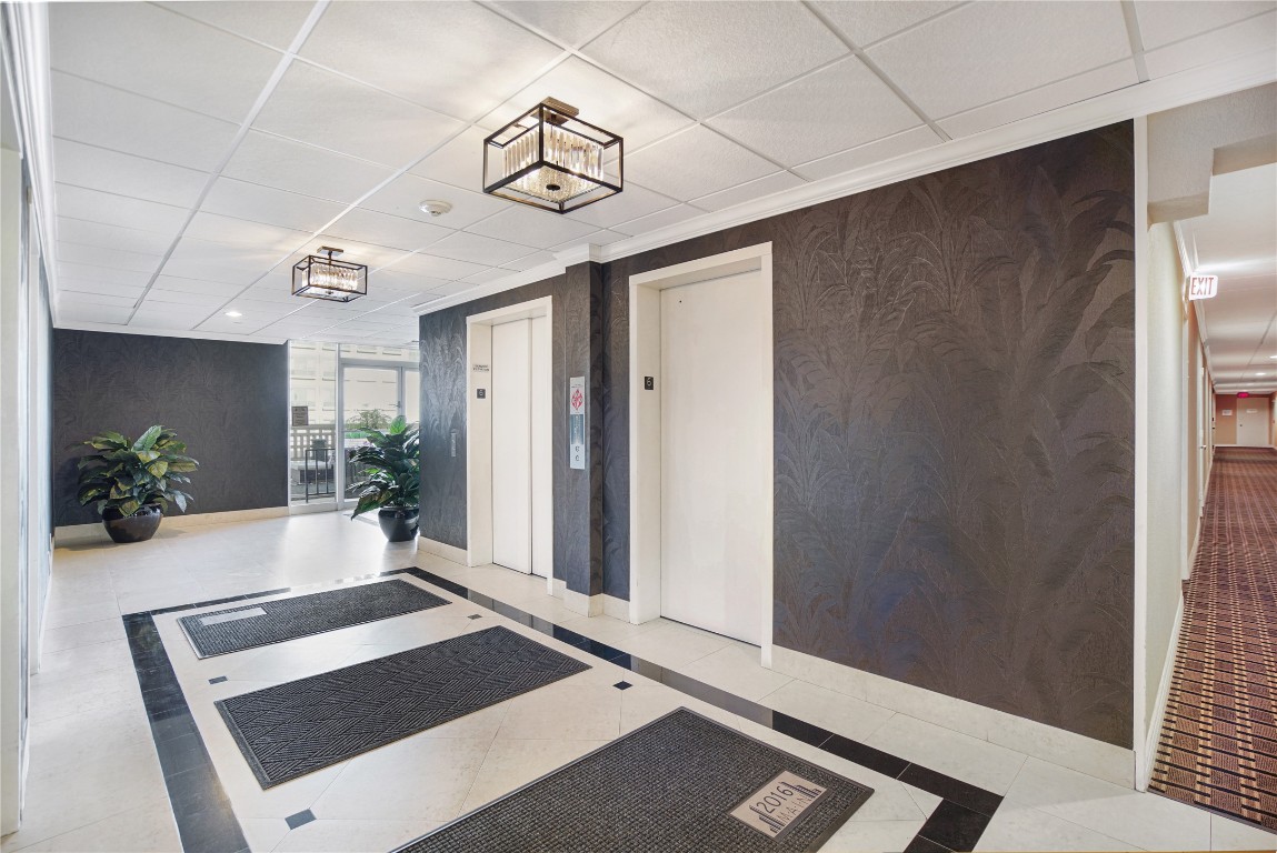 2016 Main Street, Unit 2405 Houston, TX 77002 - Photo 29 of 40 a view of a hallway with a potted plant