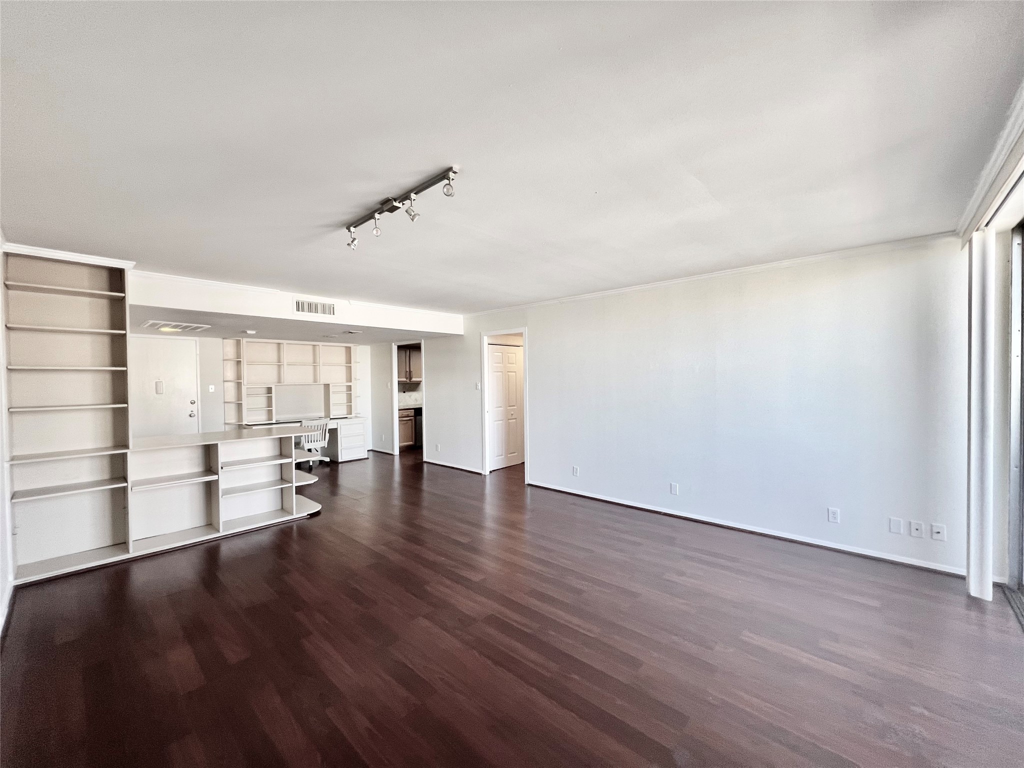 2016 Main Street, Unit 2405 Houston, TX 77002 - Photo 3 of 40 wooden floor in an empty room with a window