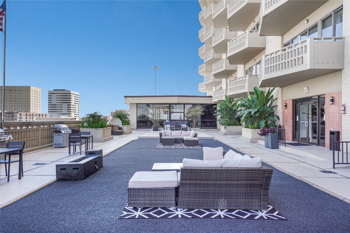 2016 Main Street, Unit 2405 Houston, TX 77002 - Photo 31 of 40 a view of a patio with couches and potted plants