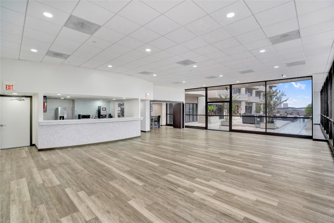 2016 Main Street, Unit 2405 Houston, TX 77002 - Photo 34 of 40 a view of an empty room with wooden floor and a window
