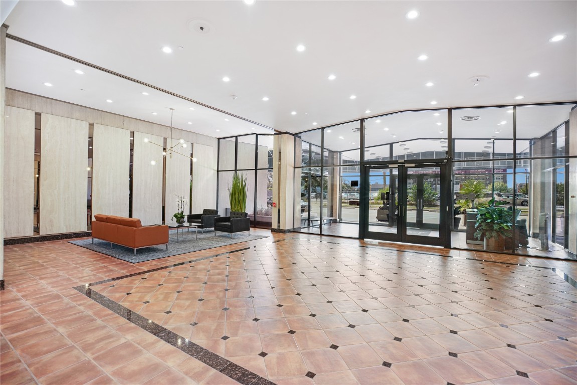 2016 Main Street, Unit 2405 Houston, TX 77002 - Photo 36 of 40 a view of a hall with floor to ceiling windows