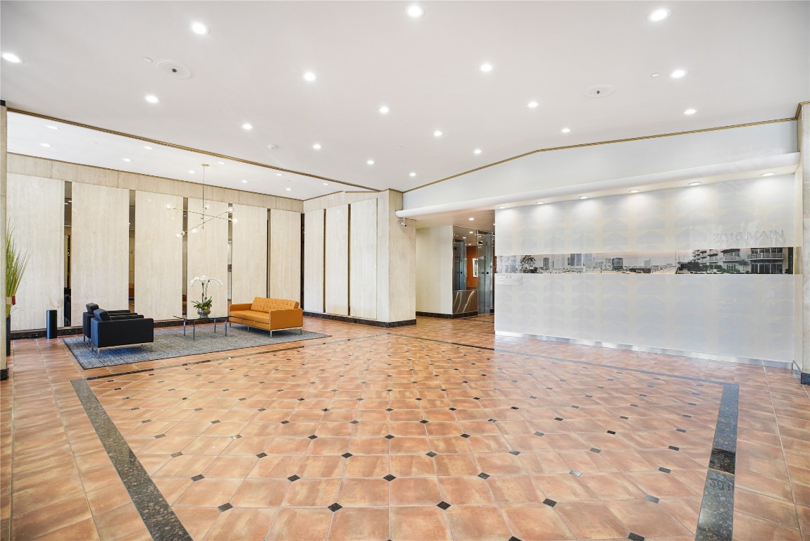 2016 Main Street, Unit 2405 Houston, TX 77002 - Photo 37 of 40 a view of a lobby with a couch and a rug