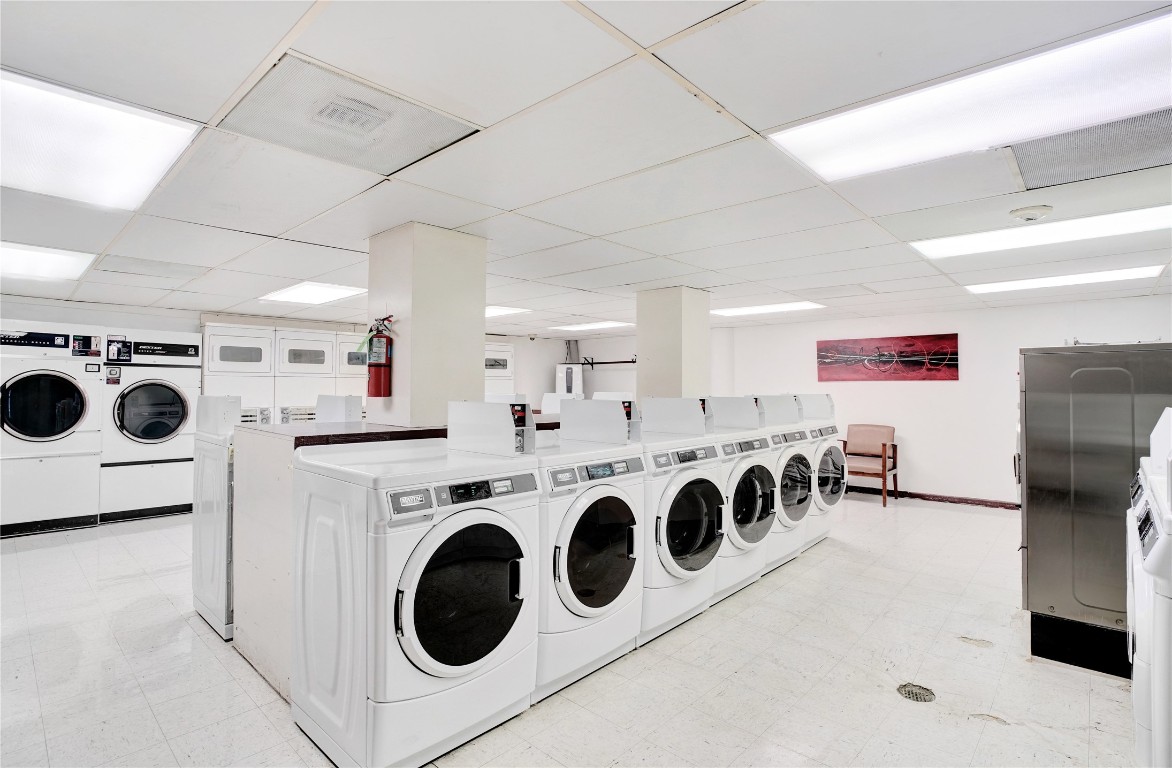 2016 Main Street, Unit 2405 Houston, TX 77002 - Photo 38 of 40 a utility room with multiple dryer and washer