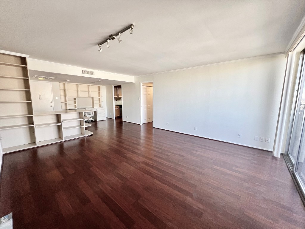 2016 Main Street, Unit 2405 Houston, TX 77002 - Photo 7 of 40 wooden floor in an empty room with a window