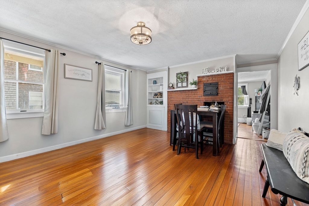 24 River Street, Unit B Danvers, MA 01923 - Photo 2 of 28 a view of a livingroom with furniture and wooden floor