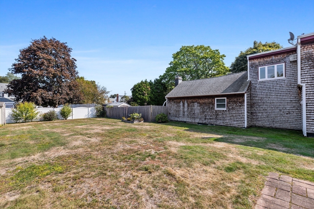 24 River Street, Unit B Danvers, MA 01923 - Photo 21 of 28 a backyard of a house with lots of green space