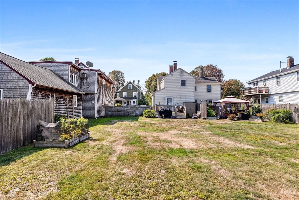 24 River Street, Unit B Danvers, MA 01923 - Photo 23 of 28 a view of a house with a yard
