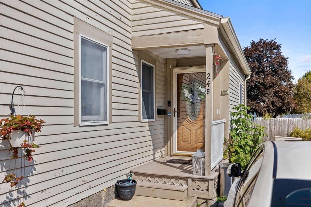 24 River Street, Unit B Danvers, MA 01923 - Photo 27 of 28 a view of a house with potted plants